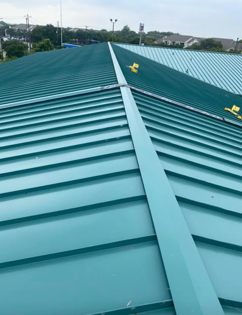 Green commercial metal roof ridge and valley for Metal Roof Repair in Breckenridge