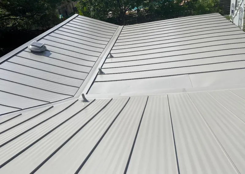 Solar attic fan installed on a metal roof for Roof Ventilation in Breckenridge
